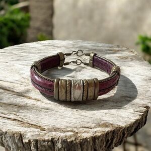 Stunning deep red leather cuff style bracelet with brass bands throughout